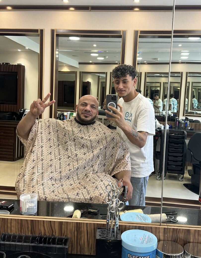 A client and barber inside RK Salon